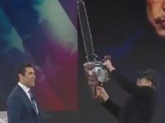 Elon Musk wields chainsaw on stage as ex sends him message